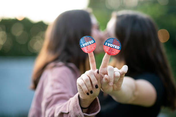 istock Two Women Kiss After Voting 1279703717