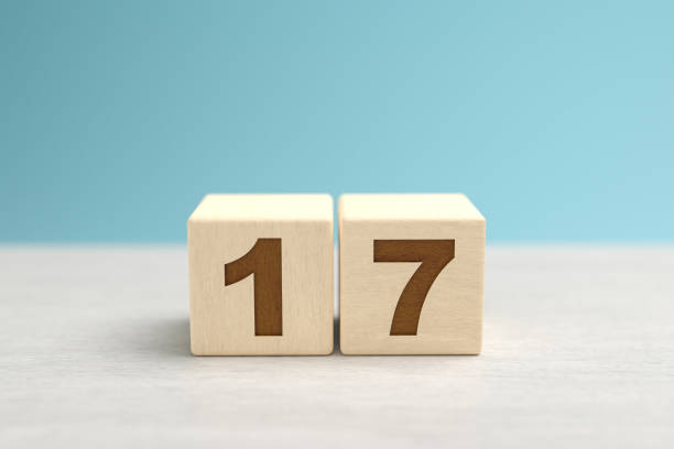 istock Wooden toy blocks forming the number 17. 1279704507