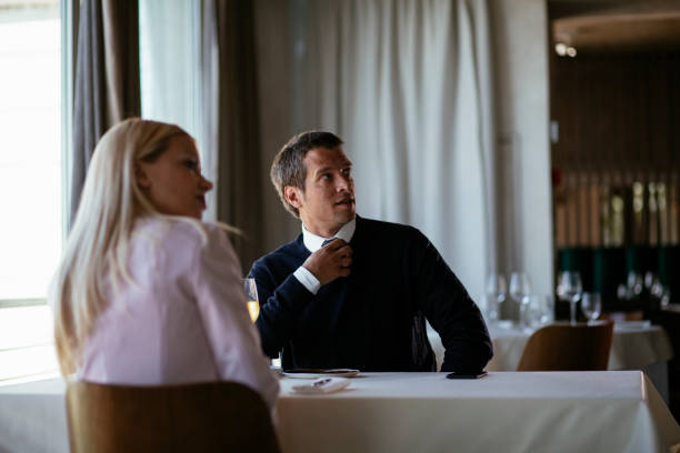 istock Handsome businessman dressed in the suit drinking wine. 1279705263