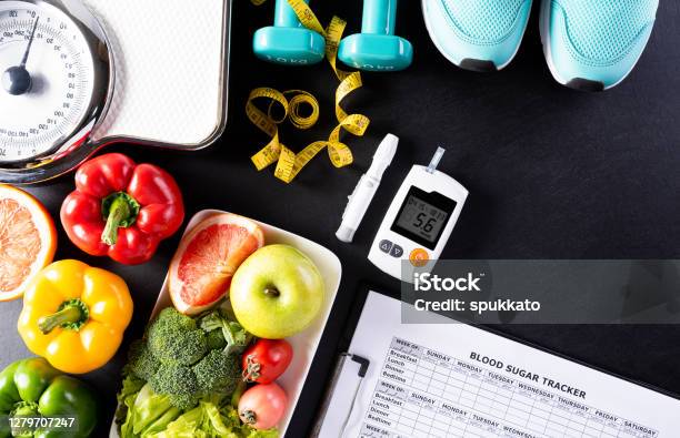 World Diabetes Day Healthcare And Medical Concept Healthy Food Including Fresh Fruits Vegetables Weight Scale Sports Shoes Dumbells Measure Tape And Diabetic Measurement Set On Black Background Stock Photo - Download Image Now