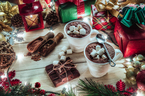 istock Christmas table setup with homemade chocolate mug with marshmallows and candlelight lamp 1279709840