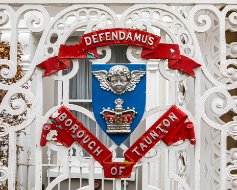 Close-up of the coat of arms of the town of Taunton in Somerset, UK.  The motto Defendamus translates to Let Us Defend.