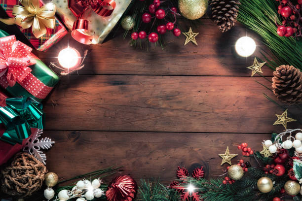 istock Christmas lights and decoration with presents making a frame with copy space. Christmas themes. 1279710904