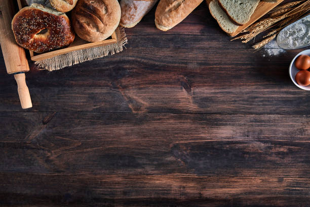 Artisanal bakery:  Fresh mixed Bun, rolls and ingredients making a frame with copy space