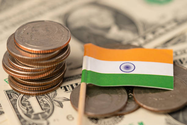 istock Stack of coins with India flag on white background. 1279711904