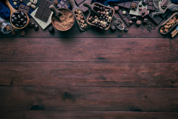 istock Chocolate, nuts and ingredients in old-fashioned style making a frame with copy space 1279711919