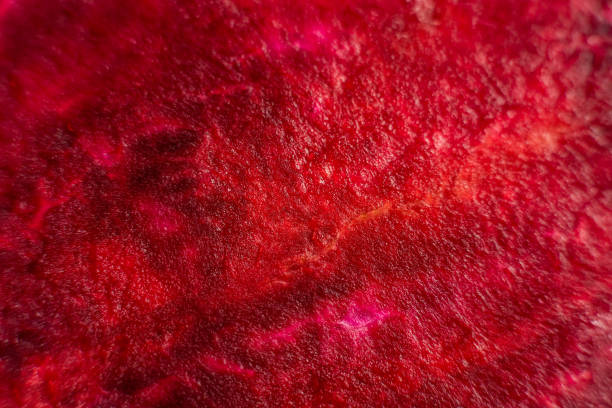 istock Macro background of beetroot sliced on white background 1279712985