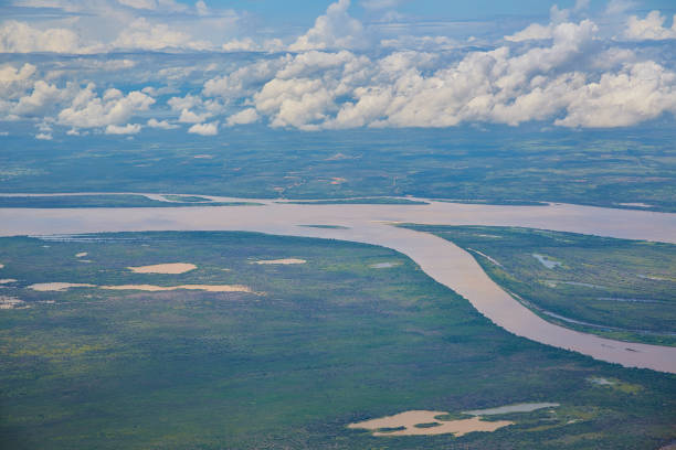 Aerial view of the Orinoco river near Puerto Ordaz, Venezuela Aerial view of the Orinoco river near Puerto Ordaz, Venezuela. The Orinoco is the second river in South America following the Amazon River in Brazil. It is one of the longest rivers with 2,140 km and its drainage basin covers 880,000 square kilometres. The Orinoco and all its tributaries are the main transport system for eastern and interior Venezuela and the llanos of Colombia. delta amacuro stock pictures, royalty-free photos & images