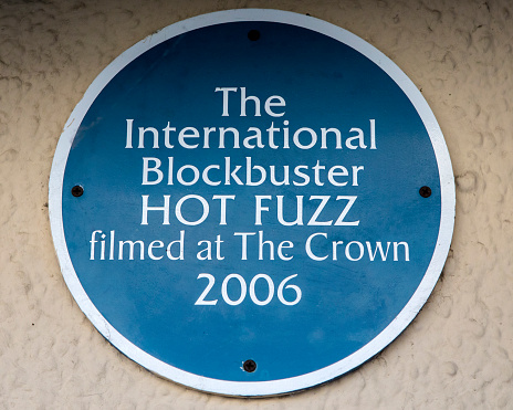 Wells, UK - March 16th 2020: Ablue plaque on the exterior of The Crown at Wells public house in the city of Wells in Somerset, marking where the movie Hot Fuzz was filmed.