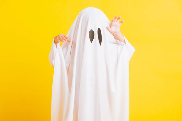 istock little cute child with white dressed costume halloween ghost scary 1279716270
