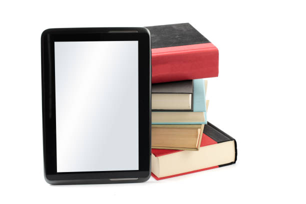 istock an e-book reader app on a tablet with a stack of traditional hard cover books isolated on white illustrating old and new technology 1279720122