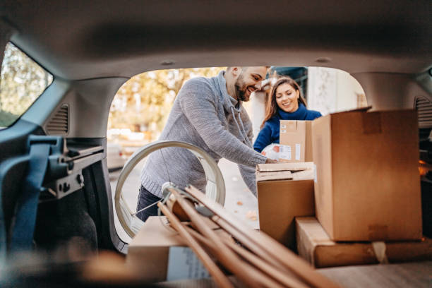 New beginings Young couple moving in new apartment with pick-up truck physical activity stock pictures, royalty-free photos & images