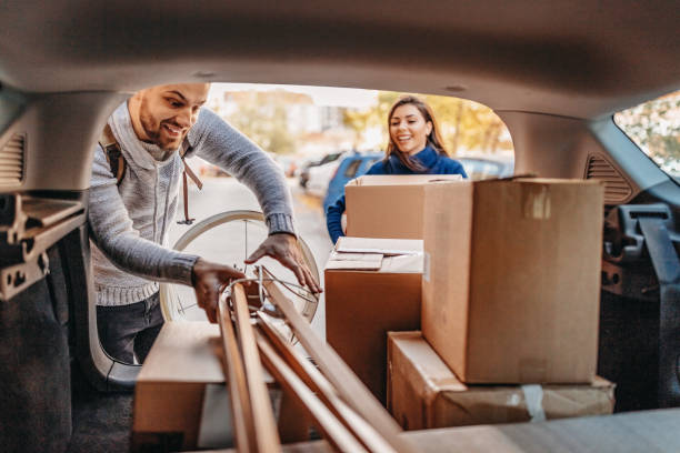 A helping hand Young couple moving in new apartment with pick-up truck trunk furniture photos stock pictures, royalty-free photos & images