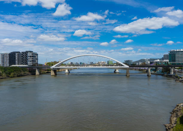 Photo of an arched span bridge over a river, Brisbane, Australia