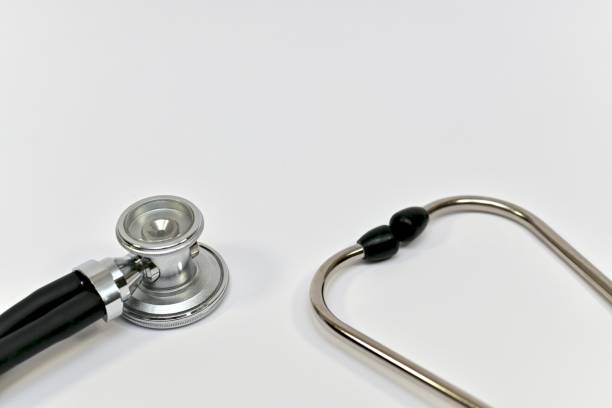 istock Two ends of a stethoscope, fragment closeup against a light background. 1279727540