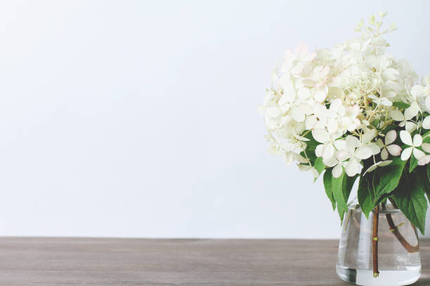istock bouquet of white flower hydrangeas on a wooden background. copy space 1279730772