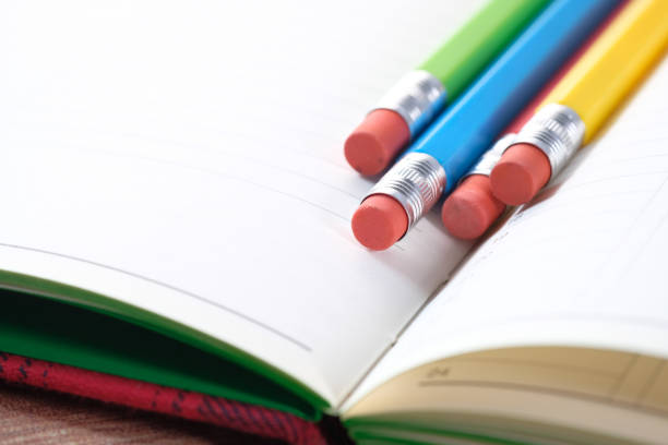 istock Close up of colorful pencils on notepad 1279731855