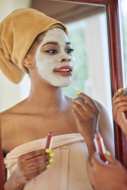 istock Woman applying liquid lipstick 1279737354
