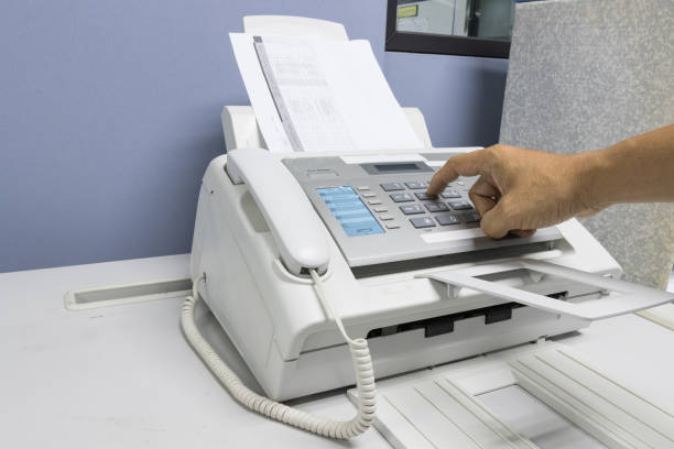 istock hand man are using a fax machine in the office, equipment for data transmission. 1279738046