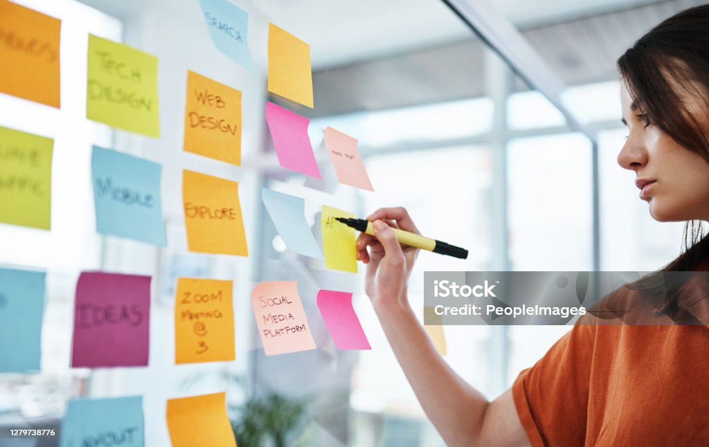 Success is so much closer when you visualise it Shot of a young businesswoman having a brainstorming session in a modern office Marketing Stock Photo