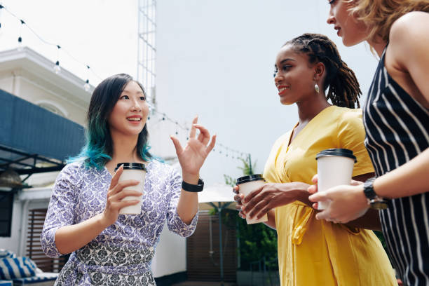 istock Woman telling story to colleagues 1279738965
