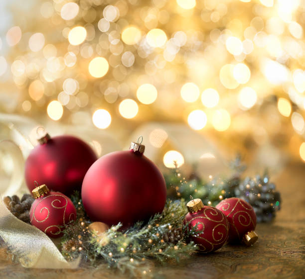 istock Christmas Red Baubles on a Defocused Gold Background 1279739619