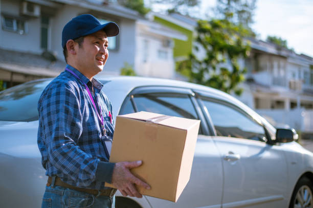 istock An Asian Delivery man bringing parcel 1279739683
