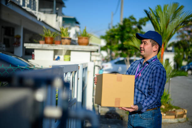 istock An Asian Delivery man bringing parcel 1279739695