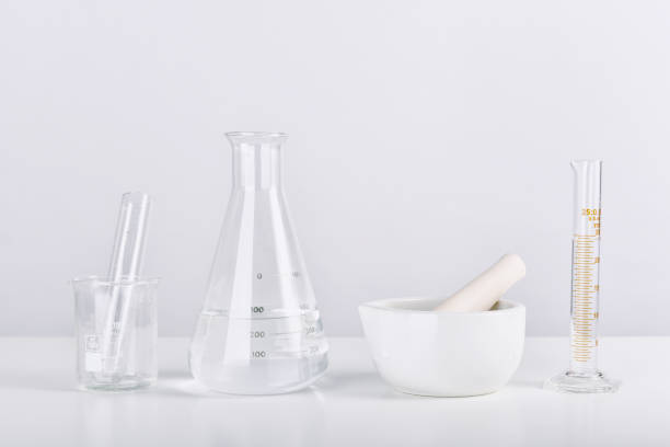 istock Group of scientific laboratory glassware and mortar with clear liquid solution, Research and development concept. 1279740642