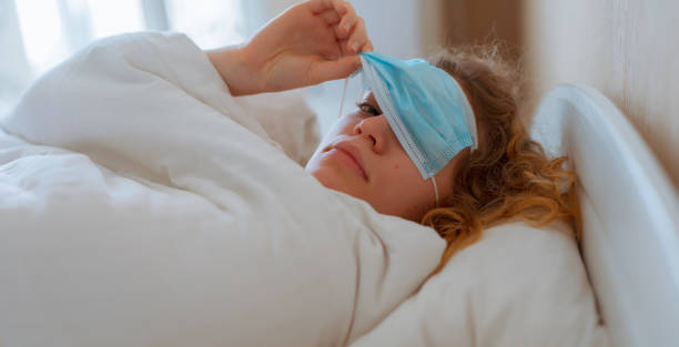 istock Woman sleep with surgical mask on her eyes 1279740726