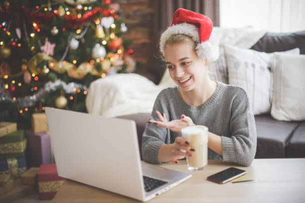 istock young woman in christmas interior with laptop 1279743968