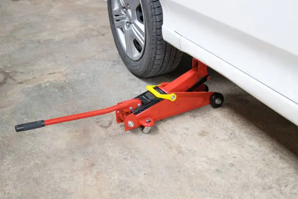 Photo of Car floor jack for car for repair check Maintenance of cars