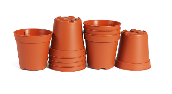 A Row of Mini Plastic flower Pots on White Background
