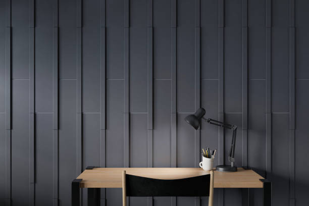 istock Workspace of working desk and blackwood wall. 1279745232