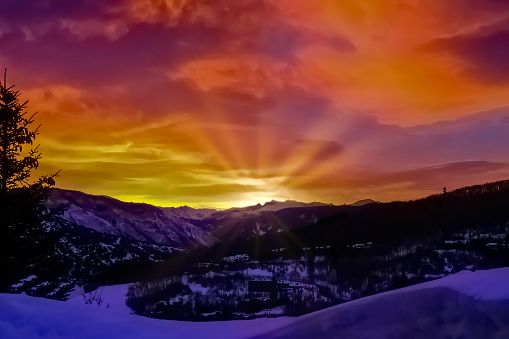 View of sunrise in Colorado Rocky Mountains as seen from the window in ski resort