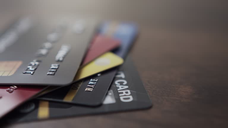 Pan shot of credit bank cards stack on the table.