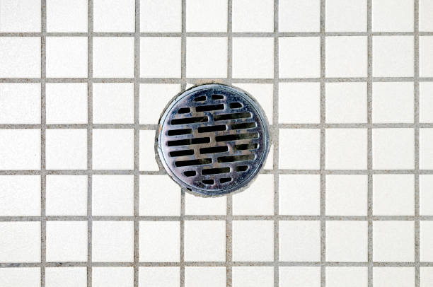 istock bathroom floor and bathroom drain 1279746937