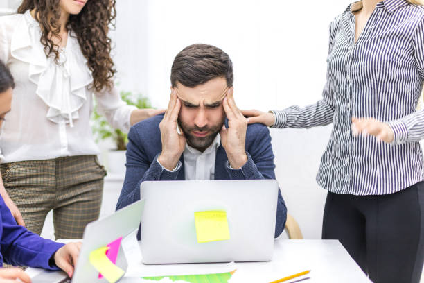 istock Photo of office manager and co-workers discussing questions. 1279748607