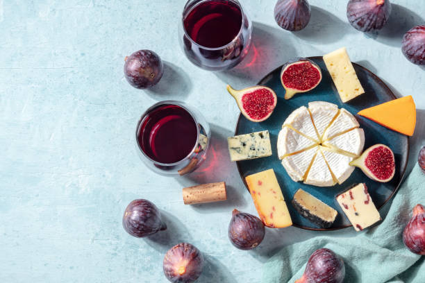 istock Cheese platter, top shot with a place for text, with wine and figs 1279750654