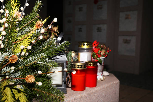 Lighting candles for the dead on All Saints Day