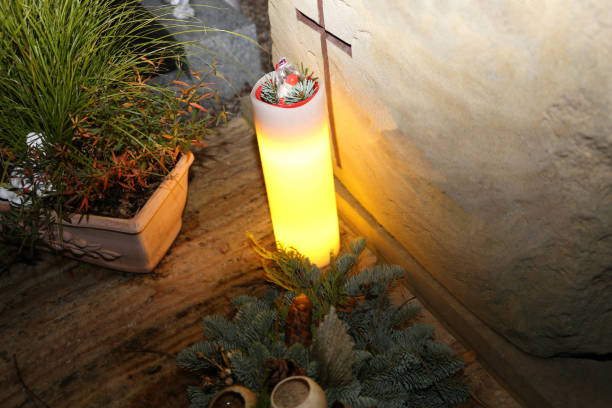Lighting candles for the dead on All Saints Day