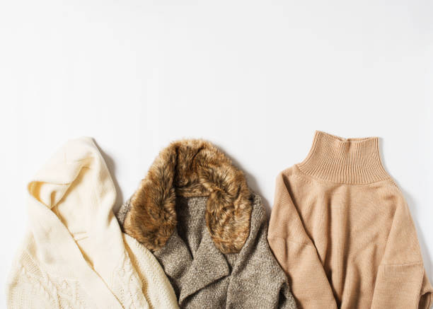 istock Set of warm cozy winter and autumn sweaters on white background 1279753036