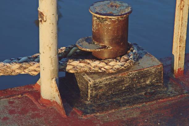 istock A mooring bollard from an old barge and ropes. 1279755742