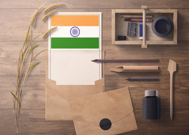istock India invitation, celebration letter concept. Flag with craft paper and envelope. Retro theme with divide, ink, wooden pen objects. 1279755951