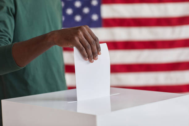 istock Putting ballot in the box 1279755999