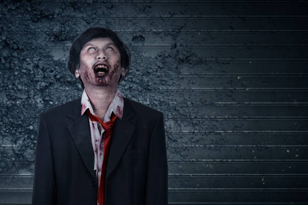 istock Scary zombie with blood and wound on his body standing 1279756184