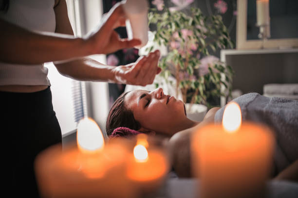 istock Young woman enjoying therapeutic  massage in spa 1279757216