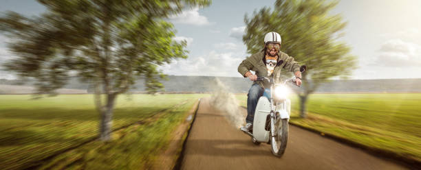 istock Man with his dog riding a moped at top speed 1279757365