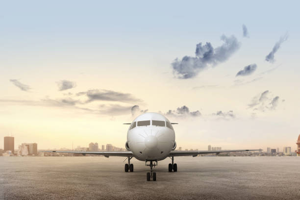 istock Airplane on the runway with cityscapes 1279757537