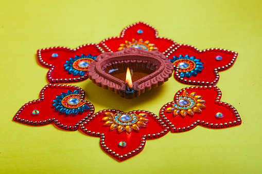happy diwali or happy deepavali greeting card made using a photograph of diya or oil lamp